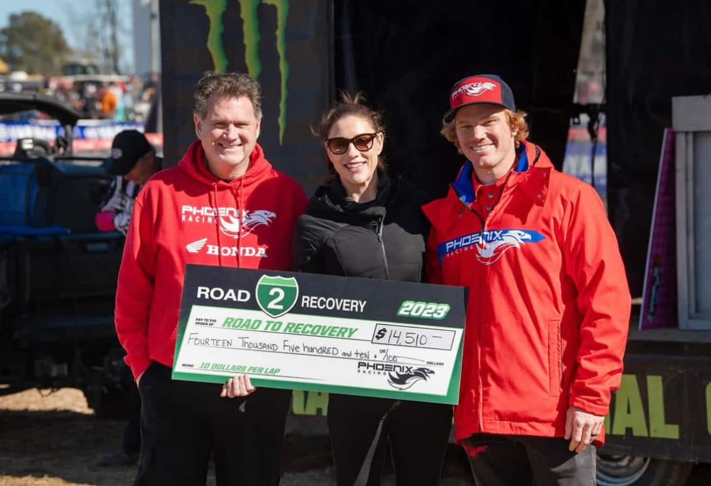 Phoenix-Racing-Donation-Check Phoenix Racing Team presenting donation check to Road to Recovery team
